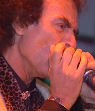 PG playing harmonca at cafe de paris